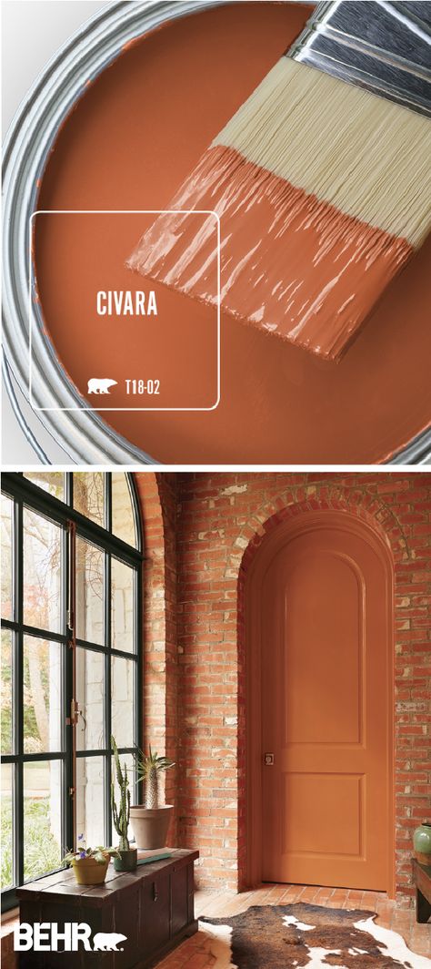 Snuggle up to the warm and cozy style of Civara by BEHR® Paint. This bright red-orange color comes together with exposed brick walls, plenty of natural light, dark wood furniture, and a cowhide rug to create this open and welcoming space. How will you use this colorful paint shade in your home? Click below for more inspiration. Dark Wood Furniture, Behr Paint Colors, Behr Paint, Exposed Brick Walls, Orange Paint, Paint Can, Colour Inspiration, Paint Shades, Trendy Bedroom