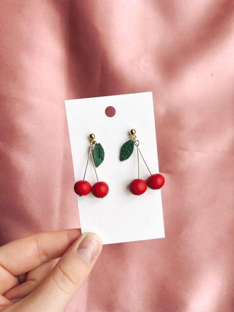 The cherry earrings are here just in time for summer! They are the perfect touch to any summer look.  Fruits are all over for this summer, so don't miss out on the trend with these! All earrings are made by hand from polymer clay. Diy Cherry Earrings, Fruit Earrings Polymer Clay, Clay Cherry Earrings, Trending Clay Earrings, Cherry Polymer Clay Earrings, Cherry Clay Earrings, Polymer Clay Fruit Earrings, Fruit Clay Earrings, Polymer Clay Earrings Summer