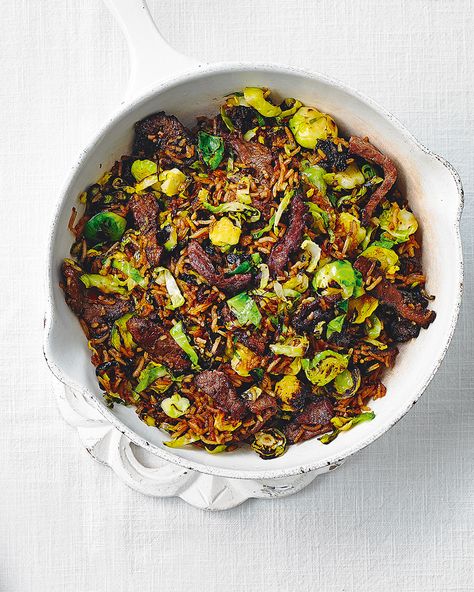 A speedy weeknight stir-fry that packs in maximum flavour in under 30 minutes. Not a fan of beef? Try using chicken breast instead. Sticky Beef, Fried Brussel Sprouts, Cooking Brussel Sprouts, Crispy Brussel Sprouts, Steak And Rice, Roasted Sprouts, Sprouts With Bacon, Delicious Magazine, Sweet Chilli Sauce