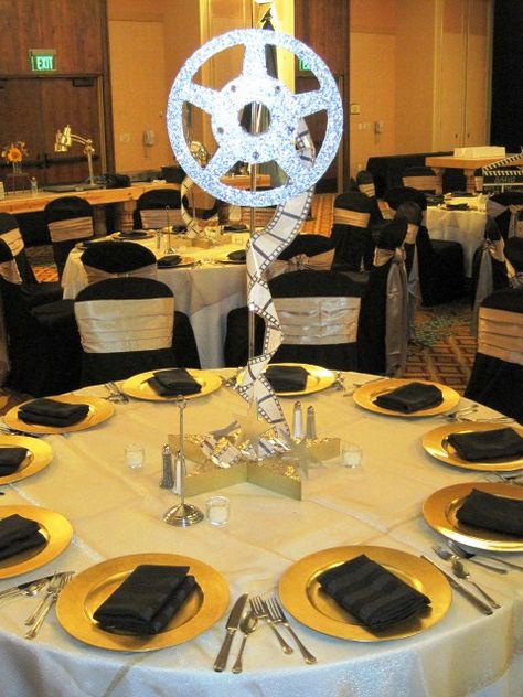 film reel centerpieces | Flickr - Photo Sharing! Diy Film Reel Decoration, Film Reel Centerpiece, Movie Reel Centerpiece, Oscars Theme Party Centerpieces, Movie Wedding Centerpieces, Movie Theme Table Decorations, Movie Theme Centerpieces, Movie Table Decorations, Old Hollywood Table Decor