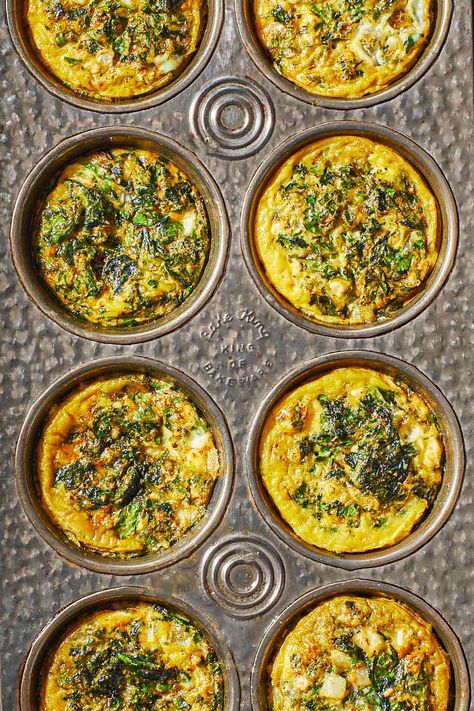 Overhead shot of Spanakopita egg muffins in a muffin tin, showing the herbs and spinach and golden edges. Shrimp Kabob Recipes, Spinach Muffins, Egg Muffins Recipe, Mediterranean Breakfast, Egg Bites Recipe, Healthy Breakfast Recipe, The Mediterranean Dish, Spinach Feta, Healthy Breakfast Ideas