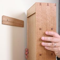 How to Hang a Cabinet on the Wall - Fine Woodworking Article. Or, y'know, the OMFG Tall Bookshelves Of Wonder. Else what's a 12' ceiling for? How To Hang Cabinets, Log Walls, Bathroom Sink Storage, Tall Bookshelves, Desk Diy, Kabinet Dapur, French Cleat, How To Hang, Diy Holz