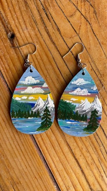 Paintings by Mary on Instagram: "I decided I wanted to try to make some landscape earrings this is the first set with a mountain range. #woodearrings #paintedearrings #earrings #handpainted #tinyart #tinyartwork #tinycanvas #minicanvas #minipainting #wearableart #mountains #crafter #lawrenceart #lawrencekansas #landscapepainting" Hand Painted Earrings Wood, Mdf Earrings, Landscape Earrings, Fabric Jewellery, Painted Rocks Kids, Products Ideas, Earrings Wood, Hand Painted Earrings, Diy Wood Signs