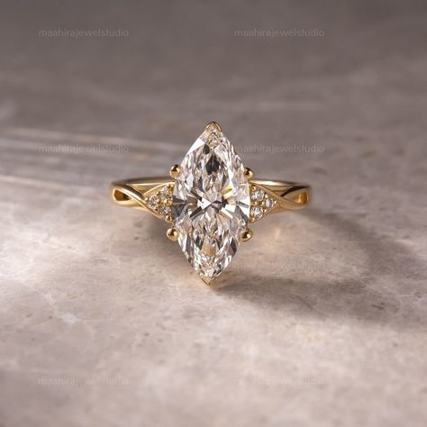 3CT Marquise Cut Lab Grown Diamond Cluster Split Band Engagement Ring, 10K Yellow Gold Unique Anniversary Ring, Promise Ring, Gift For Her  ▶ GEMSTONE DETAILS: ▷ Cut Type: Marquise Cut ▷ Carat weight: 3.02 CT ▷ Color Grade: G ▷ Clarity: VS1 ▷ Cut Grade: Excellent/Ideal ▷ Polish: Excellent ▷ Symmetry: Excellent ▷ Hardness: 10/10 ▷ Type: Lab-Grown Diamond (TYPE 2A/CVD) ▷ Certification: IGI/GIA ▶ SIDESTONE DETAILS: ▷ Cut Type: Round Cut ▷ Carat weight: 0.30CT ▶ JEWELRY METAL & OTHER DETAILS: ▷ Meta Unique Marquis Engagement Rings, Wedding Ring Marquise Gold, Marquis Yellow Gold Engagement Ring, Vintage Pear Engagement Ring Gold, Engagement Marquise Rings, Marquise Engagement Ring Platinum, 4ct Marquise Engagement Ring, Marquee Cut Engagement Ring, Marquise Engagement Ring Unique