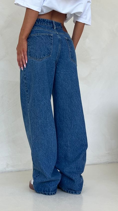 Elevate your wardrobe with our new and improved Blue Mid Rise Wide Leg Jeans—your new go-to staple. Crafted with a comfortable stretch, these versatile jeans can be styled mid or high-waisted, featuring a wide-leg silhouette. Perfect for any occasion, from casual outings to dressier events, they serve as the ideal foundation for your capsule wardrobe. Designed for longevity, these jeans will quickly become your favourite piece, effortlessly pairing with countless outfits for years to come. Blue Jean Outfits, Mid Waist Jeans, Best Stretches, Track Shorts, New And Improved, Jeans Outfit, Good Stretches, Jean Outfits, Wide Leg Jeans