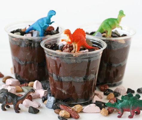 A long standing kid favorite “worms and dirt”:  Chocolate pudding, Oreo cookies, crushed, Gummy worms, Chocolate rocks Twoasaurus Birthday, Dinosaur Classroom, Dinosaur Food, Dinosaur Craft, Jurassic Park Party, Dirt Cups, Chocolate Rocks, Party Dinosaur, Children Crafts