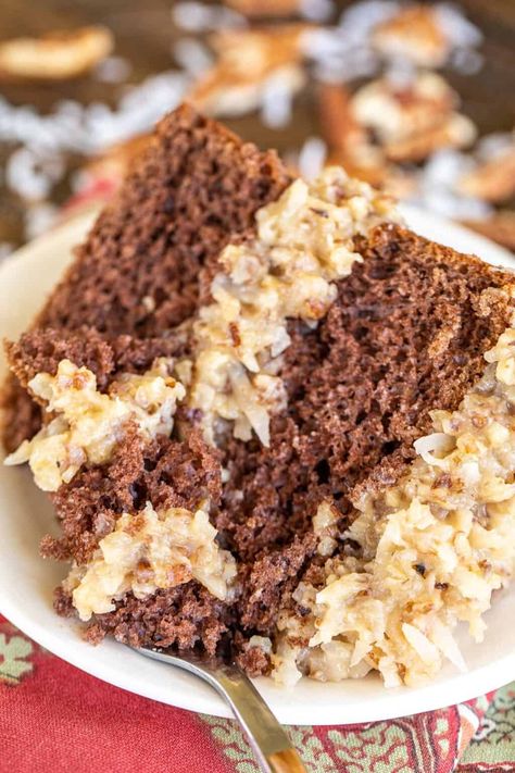 Easy German Chocolate Cake - if you like chocolate cake, coconut, and pecans, you are going to LOVE this dessert. This is a semi-homemade cake, meaning that I doctored up a box of cake mix and made the frosting from scratch. The frosting is to-die-for! Evaporated milk, sugar, egg yolks, butter, vanilla, coconut, and pecans. Can make in advance and refrigerate until ready to serve the cake. Great for dinner parties, birthdays, and potlucks. Easy German Chocolate Cake, Homemade Chocolate Buttercream Frosting, Homemade German Chocolate Cake, Chocolate Cake Mix Recipes, German Chocolate Cake Recipe, Homemade Chocolate Frosting, German Chocolate Cake Mix, Chocolate Sheet Cake, Plain Chicken