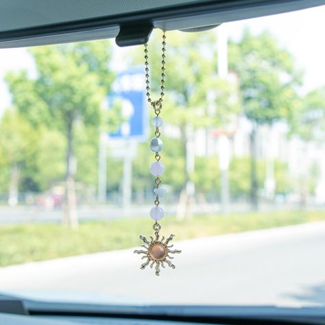 PRICES MAY VARY. [Cute Sun Decor] The pink car charm comes with quality natural stones, pearls and crystals. It's unique and eye-catching decor for you. This sun hanging car decor is approx 7.1” in length and would make the perfect decor for your car rear view mirror. [Boho Handmade Car Charm] The rear view mirror accessories hanging with a golden sun charm is symbol of good fortune and vitality, will accompany you on your driving or journeys. Keep this sun charm, it can warm energize and illumi Hanging Car Decor, Sun Decor, Mirror Boho, Boho Car Accessories, Mirror Accessories, Rear View Mirror Accessories, Rear View Mirror Decor, Sun Charm, Car Accessories For Women