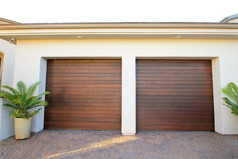 Traditional roll up garage doors can be made out of wood versus traditional steel. Wooden Garage Doors Modern, Garage Skins, Industrial Homes, Rolling Doors, Custom Wood Garage Doors, Roll Up Garage Door, Faux Wood Garage Door, Metal Garage Doors, Roll Up Door