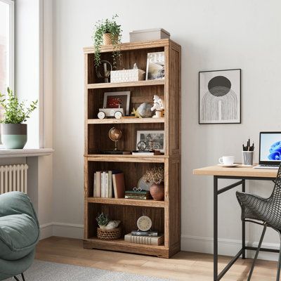 Introducing a versatile 5-tier bookcase with rustic charm, perfect for any room. Crafted from engineered wood with a light woodgrain finish and wood knots, it offers a touch of rustic appeal. With five open shelves, including two fixed and three adjustable, you have ample space to display books, baskets, photos, or trinkets. Its paneled detailing, bracket-style base, and tapered crown molding seamlessly complement various aesthetics. The top surface is perfect for your favorite plants. This 68" Light Wood Bookcase, Modern Rustic Bookshelf, Tall Modern Bookshelf, Decor On Top Of Bookcase, Wooden Bookshelf Decor, Home Library Layout, Top Of Bookcase Decor, Bedroom Bookcase Ideas, Aesthetic Bookshelf Decor