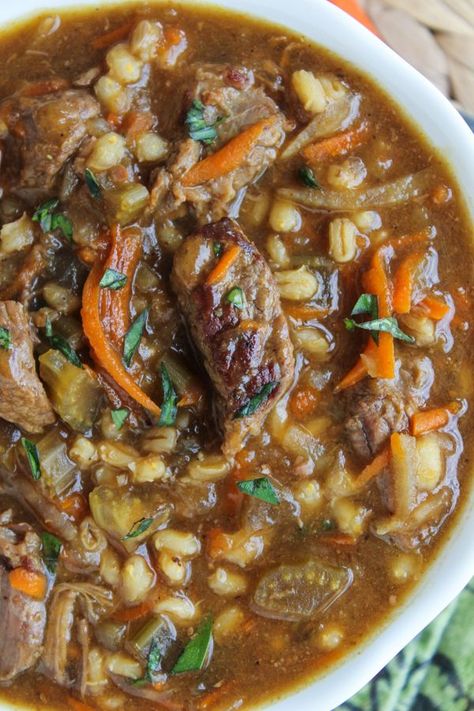 Beef Barley Soup (Slow Cooker) from The Food Charlatan. This soup is lovingly simmered on the stove or in the crock pot to produce the richest Beef Barley Soup recipe I've ever tasted. Shredded carrots and potatoes give it a fabulous, thick texture. #beef #soup #barley #crockpot #slowcooker #vegetable #healthy The Food Charlatan, Beef Barley, Beef Barley Soup, Spicy Soup, Food Charlatan, Hearty Soup, Barley Soup, Soup And Stew, Crock Pot Soup