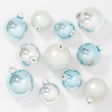 Get a versatile option for your styling your holiday tree with the 42-Count Round Glass Christmas Tree Ornament Set from Wondershop™. This set includes 42 ball ornaments handcrafted from glass in a variety of colors. The simple design makes them easy to pair with a wide variety of ornaments, lights and garlands, and they're equipped with top metal loops that you can attach hooks to for easy hanging. Wondershop™: Welcome to the Wondershop. Coastal Christmas Tree, Target Christmas, Glass Christmas Balls, Blue Christmas Decor, Coastal Christmas Decor, Silver Christmas Decorations, Candy Cane Christmas Tree, Winter Wonderland Christmas, Glass Christmas Tree Ornaments