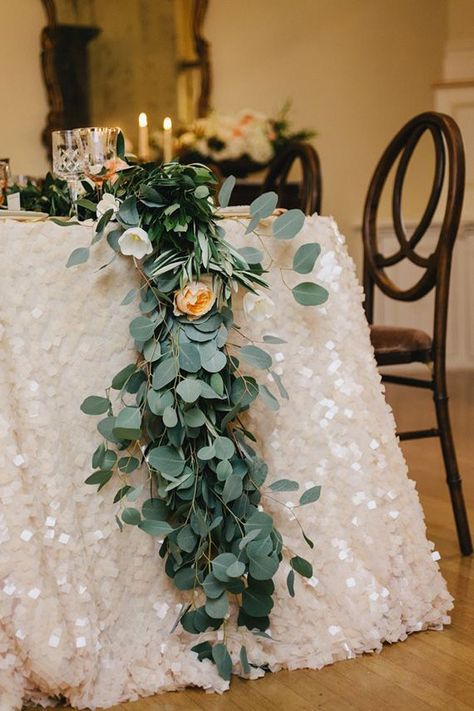 These chunky sequins, soft plants + warm candles make for a breathtaking wedding dinner scene. Branch Arch Wedding, Wedding Reception Head Table, Eucalyptus Wedding Decor, Reception Head Table, Wedding Branches, Greenery Wedding Decor, Wedding Table Linens, Sequin Tablecloth, Wedding Cake Table