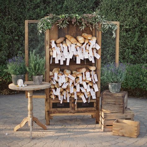 When it comes to escort cards, paper isn’t your only option. At this Provençal reception designed by Jesi Haack, escort cards were tied to individual baguettes, then displayed in an antique hutch that JL Designs decorated with greenery and potted herbs. Related: 75 Ideas for a Rustic Wedding French Themed Wedding, French Country Wedding, Provence Wedding, Yosemite Wedding, Bridal Guide, Picnic Wedding, Reception Design, French Garden, Lavender Wedding