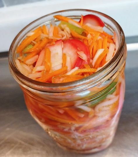 Quick Asian Pickled Vegetables: A jar of coarsely shredded and thinly sliced vegetables get a quick hot brine poured over them and hours later, you've got summer's easiest condiment. Work everything from carrots and kohlrabi to onions and radish and more into the mix. Asian Pickled Vegetables, 2024 Health, Sliced Vegetables, Meal Rotation, Carrot Vegetable, Seasoned Rice Vinegar, Pickled Cabbage, Asian Vegetables, Fermented Vegetables