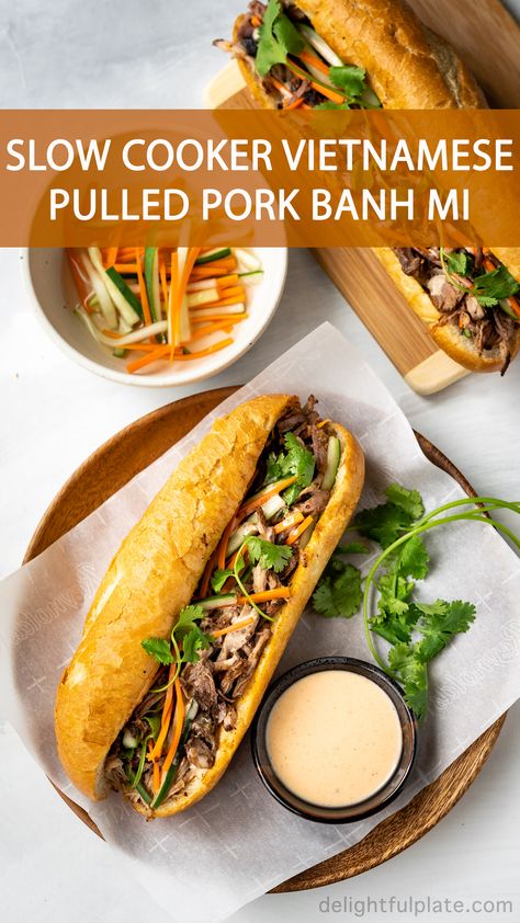 This Vietnamese Pulled Pork Banh Mi features crispy Vietnamese baguette (banh mi), tender and flavorful pork, crunchy pickled vegetables and yummy sriracha mayo sauce. With a slow cooker, this banh mi sandwich recipe is super easy to make. #vietnamese #banhmi #sandwich #pulledpork #slowcooker Pulled Pork Bahn Mi Sandwich, Banhmi Sandwich, Pulledpork Slowcooker, Vietnamese Sandwich Banh Mi, Pork Banh Mi Sandwich, Vietnamese Baguette, Banh Mi Sandwich Recipe, Sriracha Mayo Sauce, Pork Banh Mi