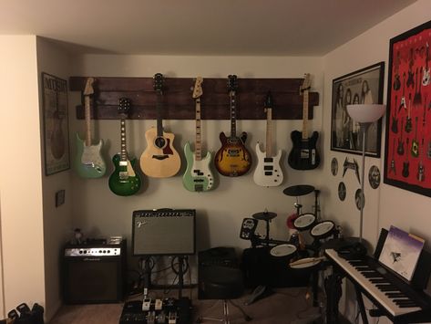 Guitar wall hangers Wall With Guitars, Guitar Wall Bedroom, Musician Room Decor, Guitars Hanging On Wall, Guitar Hanger Ideas, Guitar Room Aesthetic, Guitars On Wall, Guitar On Wall, Guitar Hanging Ideas