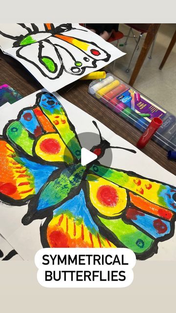 Savanna🎨 on Instagram: "Symmetrical butterflies with kindergarten! This was a fun one that the kiddos loved- and it gave them some knowledge of life cycles, symmetry, paint skills, patterns and colors in nature, and much more!   #artforkids #artwithkids #kindergartenart #artistsatwork #workinprogress #elementaryart #elementaryartclass #elementaryartteachers #elementaryteacher #artteachers #artteacher #artteachersofinstagram #artteacherlife #animalart #shading #texture #animaldrawing #realisticdrawing #artworkoninstagram #artworkoftheday #butterflyart #butterflies #kinder  #artlesson #elementaryartlesson #springart" Butterfly Symmetry Painting, Symmetrical Butterfly Art For Kids, Symmetry Art Projects, Symmetry Art For Kids, Butterfly Art For Kids, Butterfly Cycle, Symmetrical Butterfly, Colors In Nature, Symmetrical Art