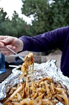 Camping food- Yummy Chili Cheese Fries! Made this for my family this weekend at our campsite. Prepare ahead of time in foil. They were a hit!! Highly recommend if you are looking for a no mess, yummy treat around the campfire! Chili Cheese Fries, Chili Cheese, Tin Foil, Cheese Fries, Camping Food, Camping Meals, Campfire, Chili, Foil