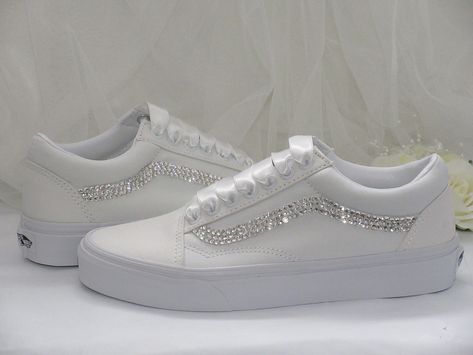 Perfect wedding sneakers to dance the night away in. These Vans are very comfortable, super sparkly and elegant. Once the day is over, wear them again and again for that added touch of luxury with any outfit.Custom hand embellished with the finest crystals to inner and outer brand panels and finished with luxurious satin ribbon lace ties.These can be personalised on request and ribbon colour changed to compliment your colour scheme.Please just ask.If you prefer a bit of added height, these are a Diy Wedding Vans, White Glitter Shoes, Wedding Reception Shoes, Bride Shoes Flats, Wedding Tennis Shoes, Wedding Trainers, Wedding Sneakers For Bride, Bride Sneakers, Wedding Vans