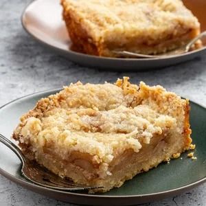 Apple Bars Recipe: How to Make It Apple Kuchen Recipe, Apple Bar Recipes, Apple Squares, Apple Crumble Topping, Old Fashioned Apple Pie, Buttery Cookie, Flaky Pie Crust Recipe, Apple Slab Pie, Apple Cakes