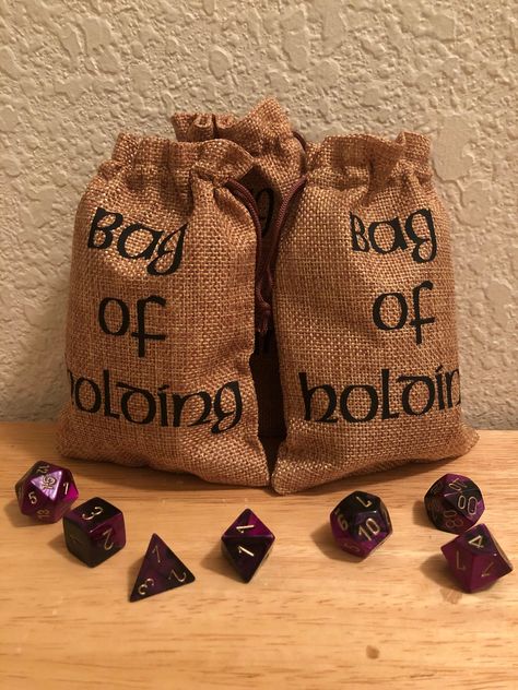 Party Favor bags for that D&D enthusiast in your life. Great for any kind of party! Even the adventuring kind!  -Each bag is 4x6 and is branded as a Bag of Holding. Can be purchased singly (dice bag) or in groups (party favor bags)  -Made of an eco friendly linen material that has the appearance of burlap. Dice are not includedbut are encouraged. -Looking for a larger size? Check out my other listing! Personalization is available if requested Dnd Party, Bag Of Holding, Everyday Home Decor, Bag For Wedding, Group Party, Party Favor Bag, Party Goodies, 13th Birthday Parties, Dice Bag