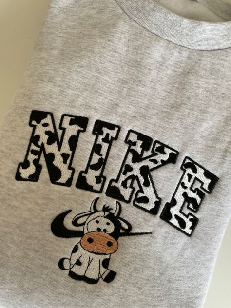 #hoodie #sweatshirt #crewneck #embroidery #aesthetic #cowprint #nike Nike Cow Crewneck, Aesthetic Nike Crewneck, Unique Nike Sweatshirts, Cow Print Nike Sweatshirt, Nike Sweatshirt Embroidered, Nike Cow Sweatshirt, Cute Nike Embroidery Sweatshirt, Nike Vinyl Sweatshirt, Custom Nike Sweater