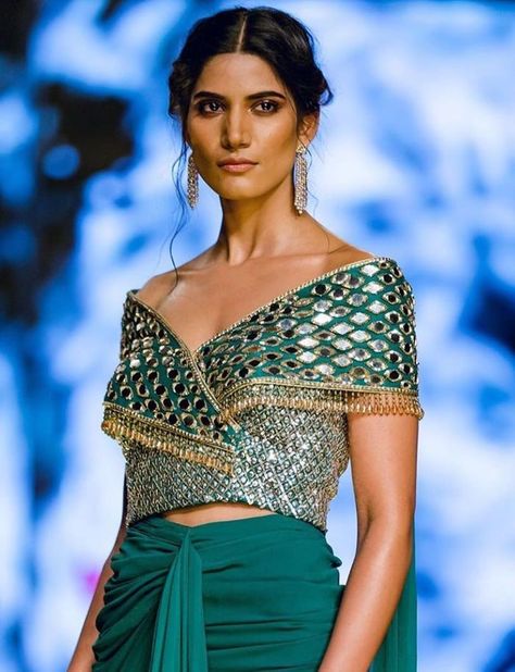 Unique Blouse Designs For Millennial Brides | WedMeGood Ruffle Blouse Designs, Saree Blouse Neck Designs, Lehenga Blouse Designs, Blouse Design Images, New Blouse Designs, Blouse Designs Indian, Trendy Blouse, Ladies Blouse Designs, Unique Blouse Designs