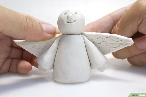 How to Make a Polymer Clay Angel (with Pictures) - wikiHow Polymer Clay Angel Ornament, Air Dry Clay Angels, Clay Angels Handmade, Polymer Clay Angel, Clay Angels, Clay Angel, Christmas Pottery, Pottery Angels, Clay Lesson