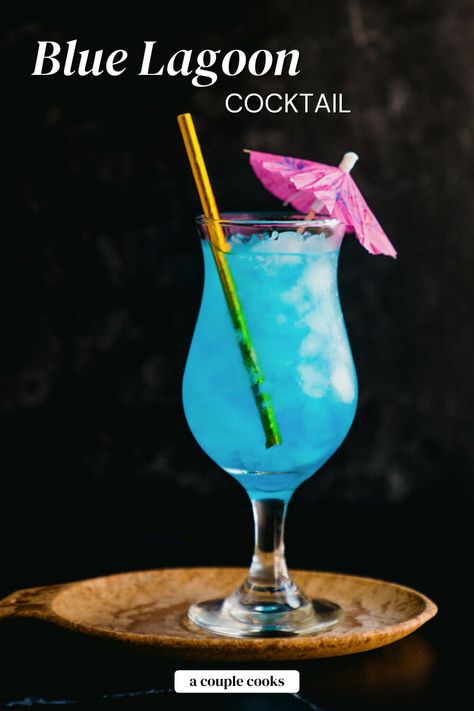 The Blue Lagoon cocktail is an easy and refreshing blue drink! Blue curacao, vodka and lemon make the bright color and citrusy flavor. #blue #bluelagoon #bluecocktail #bluelagooncocktail #bluedrink #bluecuracao Blue Lagoon Drink, Colourful Cocktails, Curacao Drink, Blue Curacao Drinks, Friday Cocktails, Poolside Drinks, Blue Lagoon Cocktail, Hawaiian Drinks, Cocktails Vodka