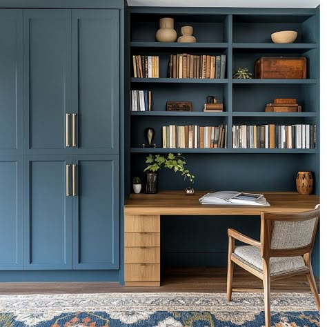 Monday blues? This built-in desk says bring it on! 💼💙 Because if you're going to work, why not do it in style? #MondayMotivation #BlueDeskVibes #WorkSmart #MainLineHomes #MainLineLiving #PhillyInteriors #LuxuryDesign #HomeOfficeGoals #UnionHomeDesign #InteriorArchitecture #MainLineDesign Built In Desk Library, Navy Blue Built In Desk, Built In Secretary Desk, Desk In Between Bookshelves, Navy Built Ins, Desk Built Into Wall, Office Built Ins With Desk, Blue Office Interior, Built In Desk And Shelves Office