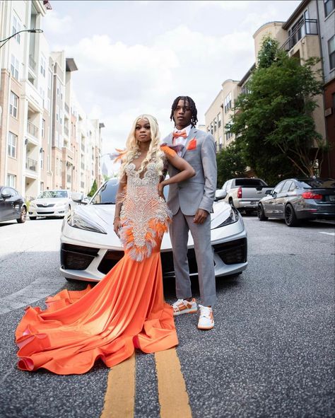 Orange Prom Send Off Ideas Decorations, Orange And Silver Prom Couple, Orange And Gray Prom Couple, Orange And Silver Prom Suit, Orange And White Prom Couples, Prom 2024 Black People, Prom Dress Inspiration Orange, Orange Prom Black Couple, Orange And Tan Prom