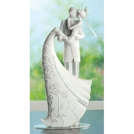 This elegant cake topper features a bride and groom embracing in a kiss, topper is accented with silver rhinestones and the bride's dress is inscribed with the following verse "When I saw you I fell in love, and you smiled because you knew. -Boito". The topper has a clear acrylic bottom for placing into the cake. Comes gift boxed. Dimensions: 9"H x 4.25"W x 2.75"D. Material(s): resin/stone mix/acrylic Color: White. Gold Crown Cake Topper, Cake Topper Wedding Couple, Butterfly Cake Decorations, Elegant Cake Topper, Heart Wedding Cake Topper, Cake Toppers Wedding, Kiss Wedding, Heart Wedding Cakes, Love Cake Topper