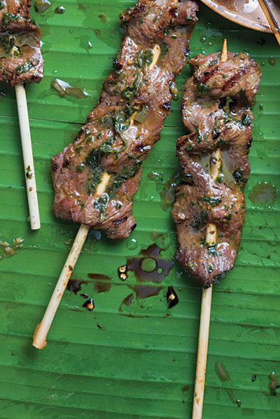 From spicy Singaporean-style shrimp  with macadamias to pork skewers with a subtle sweetness from coconut milk, these nine satay recipes are fantastic, fresh-off-the-grill summer food. Beef Satay Recipe, Beef Satay, Satay Recipe, Pork Skewers, Beef Sirloin, On A Stick, Beef Dishes, Grilled Meat, Asian Dishes