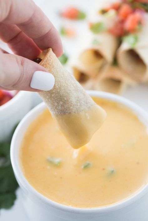 This easy Taquitos recipe uses my favorite hidden veggie taco meat and my favorite homemade cheese sauce as a queso dipping sauce. These gluten-free taquitos, or rolled tacos, are a healthier option than traditional taquitos because they are baked or air fried. Freeze taquitos for an easy lunch, dinner, or snack! Taquito Sauce Recipe, Easy Taquitos, Rolled Tacos, Confessions Of A Fit Foodie, Taquitos Recipe, Homemade Cheese Sauce, Veggie Tacos, Beachbody Recipes, Chicken Taquitos