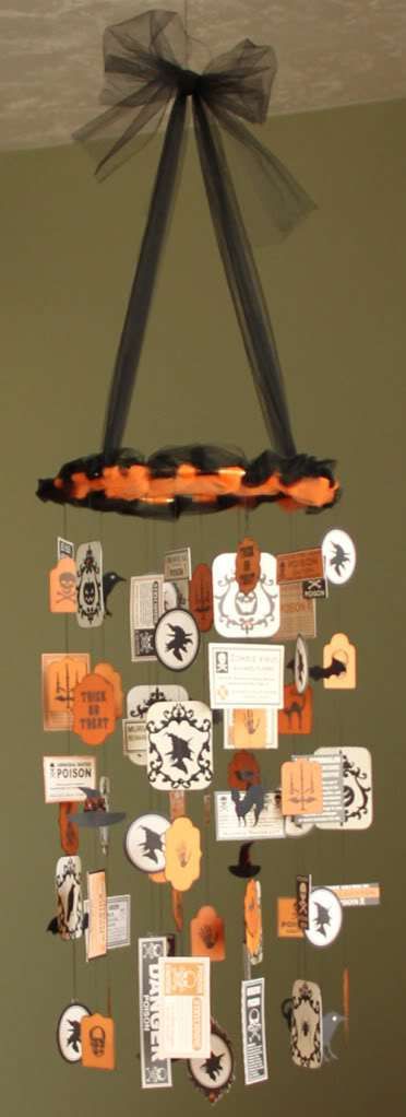 I just delivered this to Heartland Paper.  I wrote a tutorial for it, so hopefully that will show up soon on the Heartland Blog and I’ll provide a link then.  This was a lot of fun to make, using Teresa Collins’ new “Haunted Hallows” collection. Edit:  Here’s the link to … Halloween Mobile, Dekorasi Halloween, Diy Chandelier, Deco Luminaire, Cute Card, Halloween Inspiration, Halloween Paper, Fishing Line, Halloween Haunt