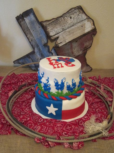 Texas theme layer cake with flag and bluebonnets Texas Birthday Party, Texas Themed Party Decorations, Texas Birthday, Texas Birthday Cake, Texas Themed Party, Texas Cake Theme, Texas Shaped Cake, University Of Texas Cake, Texas A&m Cake