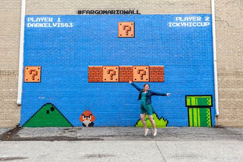 Super Mario Bros mural wall in Fargo, North Dakota. Mario Wall, Prairie Chicken, Bismarck North Dakota, Fargo North Dakota, Public Artwork, Colorful Murals, Blue Sky Background, American Road Trip, Roadside Attractions