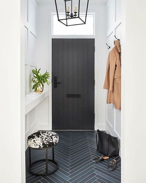 Before you reach for a bold bright or a safe gray, consider the hottest color of the moment: black. From moody nurseries to dramatic wedding gowns, people are Entryway Paneling, Herringbone Tiles, Entryway Tile, Entryway Flooring, Entryway Inspiration, Modern Entryway, Patterned Floor Tiles, Foyer Decorating, Entrance Foyer