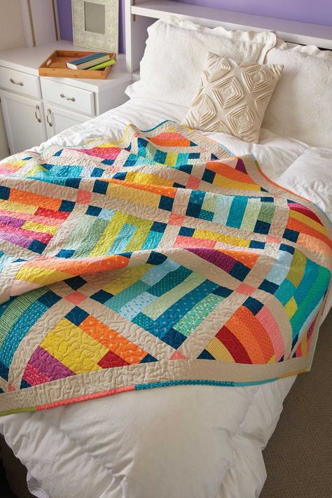 Warm and cool prints create contrast in this throw-size quilt pattern. Use batik fabrics for an exciting finish and a scrappy binding to complete the look. Prairie Quilt, Haida Gwaii, Applique Art, Colorful Quilt, Quilt Pattern Download, Quilt Modernen, Quilting Notions, Jelly Rolls, Lap Quilts