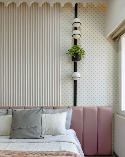 Our design efforts for daughters’ room were a justice to make them feel they are ever gorgeous. Fluted white walls with ornamented eaves on the ceiling, the blush tone upholstery on the headboard, the polka dotted wallpaper from Nilaya and the customized vertical light piece against the wall creates a space that looks like it is out of a fairy tale. The furnishing and the framing of the dresser opposite to bed creates a very dreamlike corner in the room. Dotted Wallpaper, Patterned Flooring, Wall Behind Bed, Grand Living Room, Corner Bed, Wall Painting Living Room, Statement Art Pieces, Interior Design Layout, Bed Headboard Design