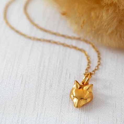 "This stunning gold fox charm necklace is hand finished and the fine detailing on the face gives it a sophisticated edge. Made from 925 sterling silver and dipped in 24 carat gold. Charm measures 1 x 0.9 x 0.6 cm and the necklace is 40 cm with an extension chain to 45 cm. This gold fox necklace makes the perfect gift for yourself, or any foxy lady you know! It is believed the fox symbolizes 'pure luck', so if you've been successful in life or are seeking a lucky charm this is the perfect necklac Fox Necklace, Gold Fox, Fox Jewelry, Foxes Necklace, Fox Pendant, Fox Gift, Letter Charm, Jewellery Gold, Yellow Gold Jewelry