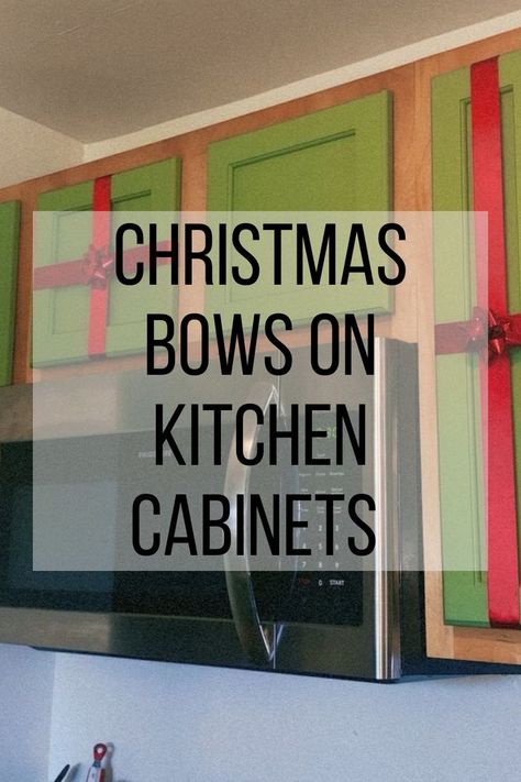 christmas bows on kitchen cabinets Wrapping Kitchen Cabinets For Christmas, Present Wrapped Cabinets, Kitchen Christmas Decorations Cabinets Diy, Xmas Kitchen Cabinet Decor Ideas, Ideas To Decorate Kitchen Cabinets For Christmas, Cabinet Door Christmas Decorations, Wrap Kitchen Cabinets Christmas, Cabinet Decorating Ideas For Christmas, Top Of Kitchen Cabinet Christmas Decor Ideas