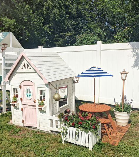 Outdoor Playhouse Setup, Diy Playhouse Decor, Garden With Playhouse, Outdoor Playhouse Toys, Kids Play House Landscaping, Playhouse Garden Ideas, Diy Outdoor Playhouse Makeover, Playhouse Outdoor Landscaping, Kids Playhouse Outdoors Diy