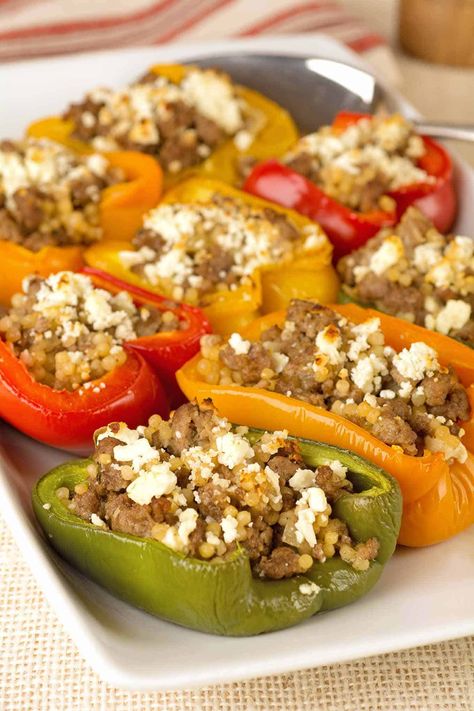 This Mediterranean-inspired stuffed pepper recipe is made with a flavorful blend of ground lamb, pearl couscous, fresh lemon, rosemary and crumbled feta cheese. #maindish #dinner #recipe #lamb Lamb Stuffed Peppers, Mediterranean Lamb, Greek Stuffed Peppers, Ground Lamb Recipes, Stuffed Pepper Recipe, Recipes Mediterranean, Pearl Couscous, Pepper Recipe, Easy Mediterranean Diet Recipes