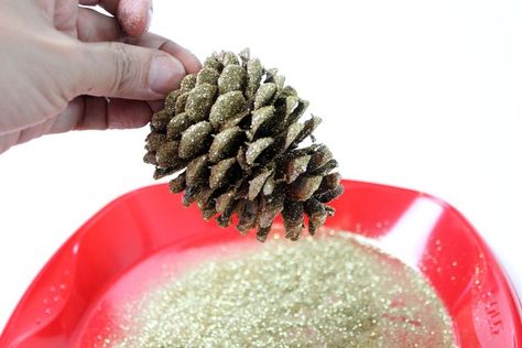 How to Decorate Pinecones With Glitter | eHow Glitter Glue Crafts, Scented Pinecones, Fir Cones, Cone Crafts, Painted Vinyl, Pinecone Ornaments, Handmade Christmas Crafts, Pine Cone Decorations, Winter Decoration