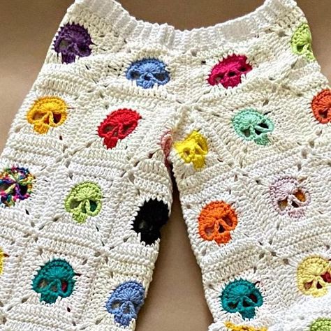 SHYLERCROCHETS | crocheter | crochet pattern designer on Instagram: "One of its kind : theme : MULTICOLORED! THE SKULL CROCHET PANTS Recreation by @salmodovar.40 written pattern for the crochet skull pants is now live on my website, ravelry, etsy shop and kofi shop (link in bio) Pattern for the matching cardigan is also live on all the above mentioned platforms Head over to my you tube channel for full tutorials of both designs (link in bio) . . . . . . #skullpants #october #ghostober # Crochet Skull Pants, Crochet Pants Pattern, Skull Crochet, Crochet Skull Patterns, Skull Pants, Pants Tutorial, Crochet Skull, Crochet Pants, Making Clothes