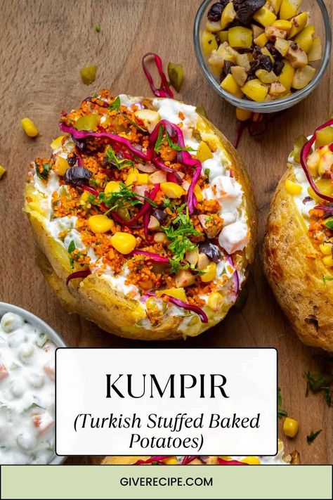 Enjoy Kumpir, a beloved Turkish street food! This large baked potato is mixed with butter and cheese, then topped with olives, corn, pickles, and more. Don't miss it in Istanbul's Ortaköy district! Turkish Baked Potato, Turkish Potatoes Recipes, Turkish Vegetarian Recipes, Kumpir Recipe, Turkish Street Food, Turkish Dishes, Baked Potato With Cheese, Best Baked Potato, Stuffed Baked Potatoes