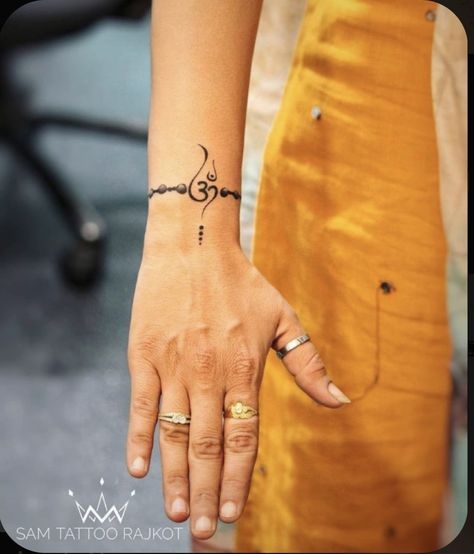 Om Tattoo Designs For Women, Om Tatoos Men, Small Om Tattoo For Women, Spiritual Wrist Tattoos For Women, Om Tatoos Design For Women, Small Shiva Tattoos For Men, Om Tattoos For Women, Shiv Related Tattoos, Tattoos For Wrist For Women