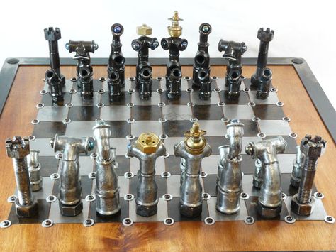 With a bit of rust remover to make them shine, you can transform your old fittings into a steampunk chess set. Source: 9 Bizarrely Beautiful DIY Chess Sets   - PopularMechanics.com Plastic Coffee Containers, Diy Chess Set, Rust Removers, Old Keys, Old Tires, Chess Sets, Old Tools, Kitchen Roll, Wood Crates